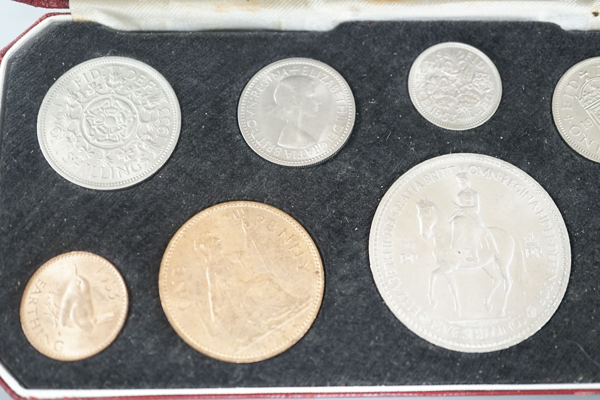 A Royal Mint Queen Elizabeth II cased set of coronation year coins 1953, UNC and a 1965 UNC set